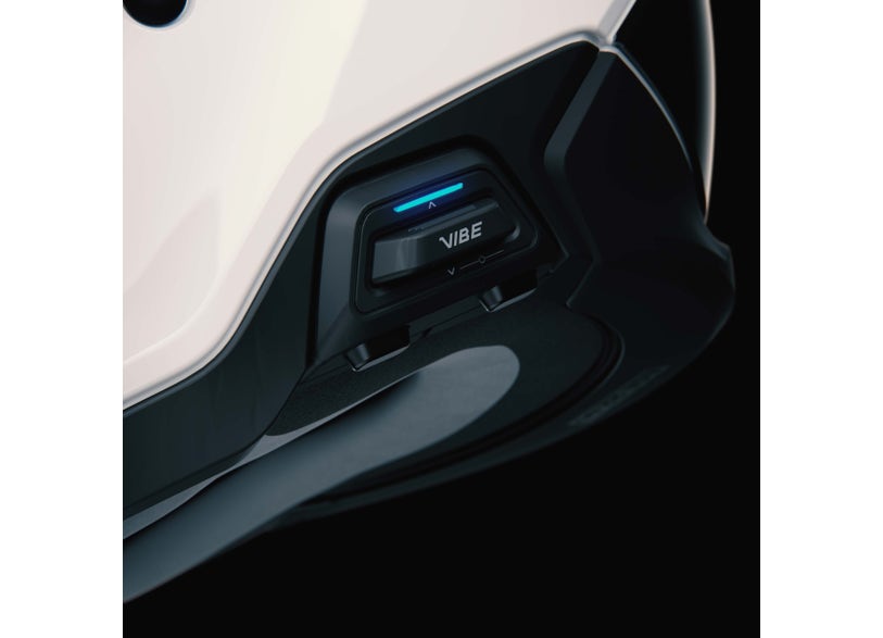 BRP Vibe communication system mounted on white Advex helmet close-up view