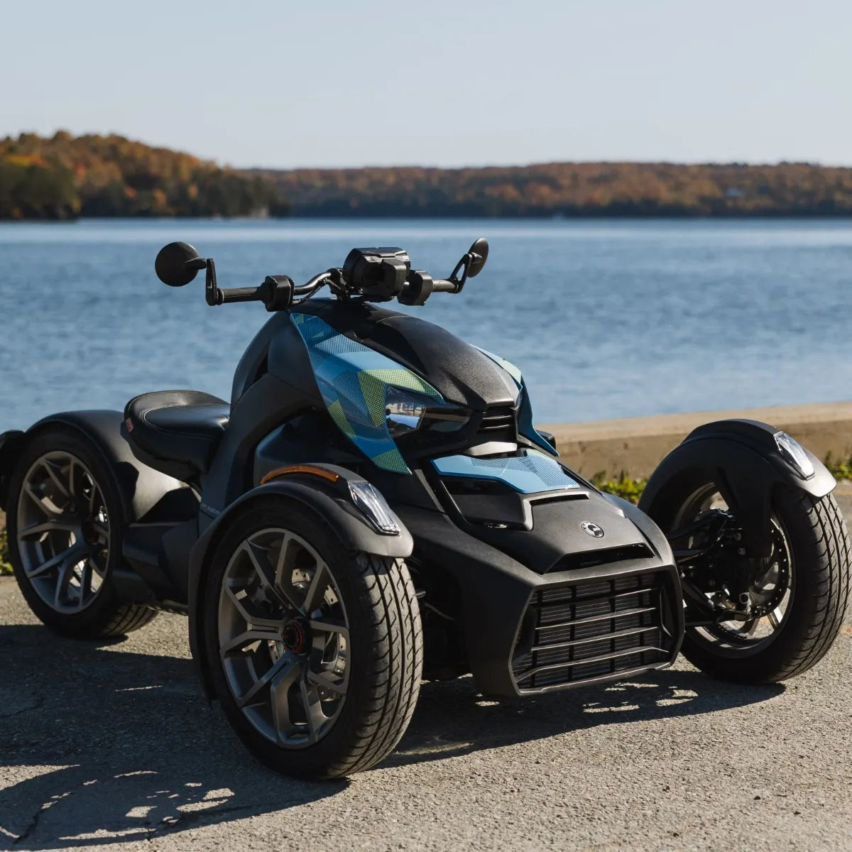 Can-Am Ryker with Exclusive Panel Kit in Urban Blue parked by a lake, 219401278