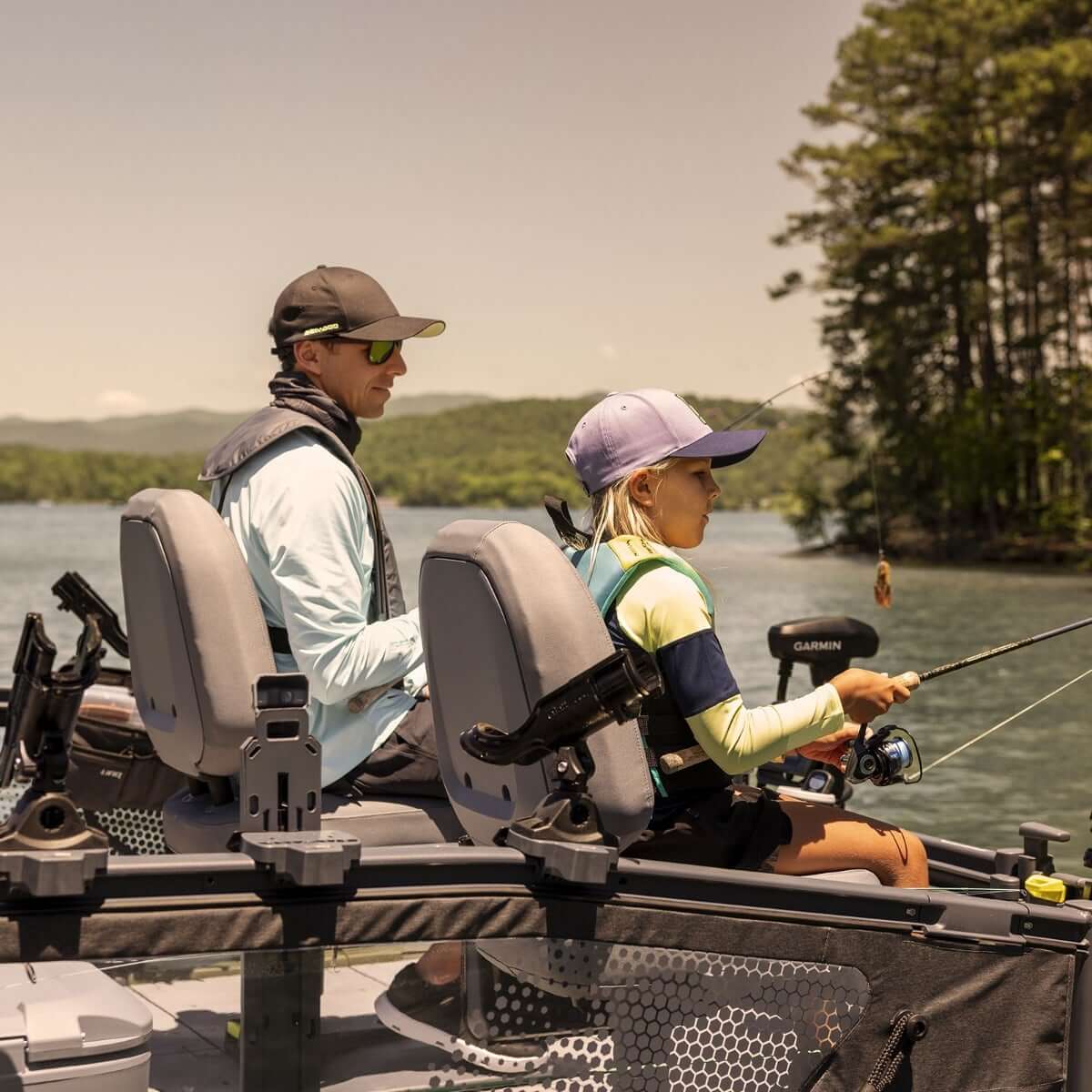 Sea-Doo Rail Rod Holder with LinQ Lite mounted on Switch pontoon boat seat rail while angler fishes