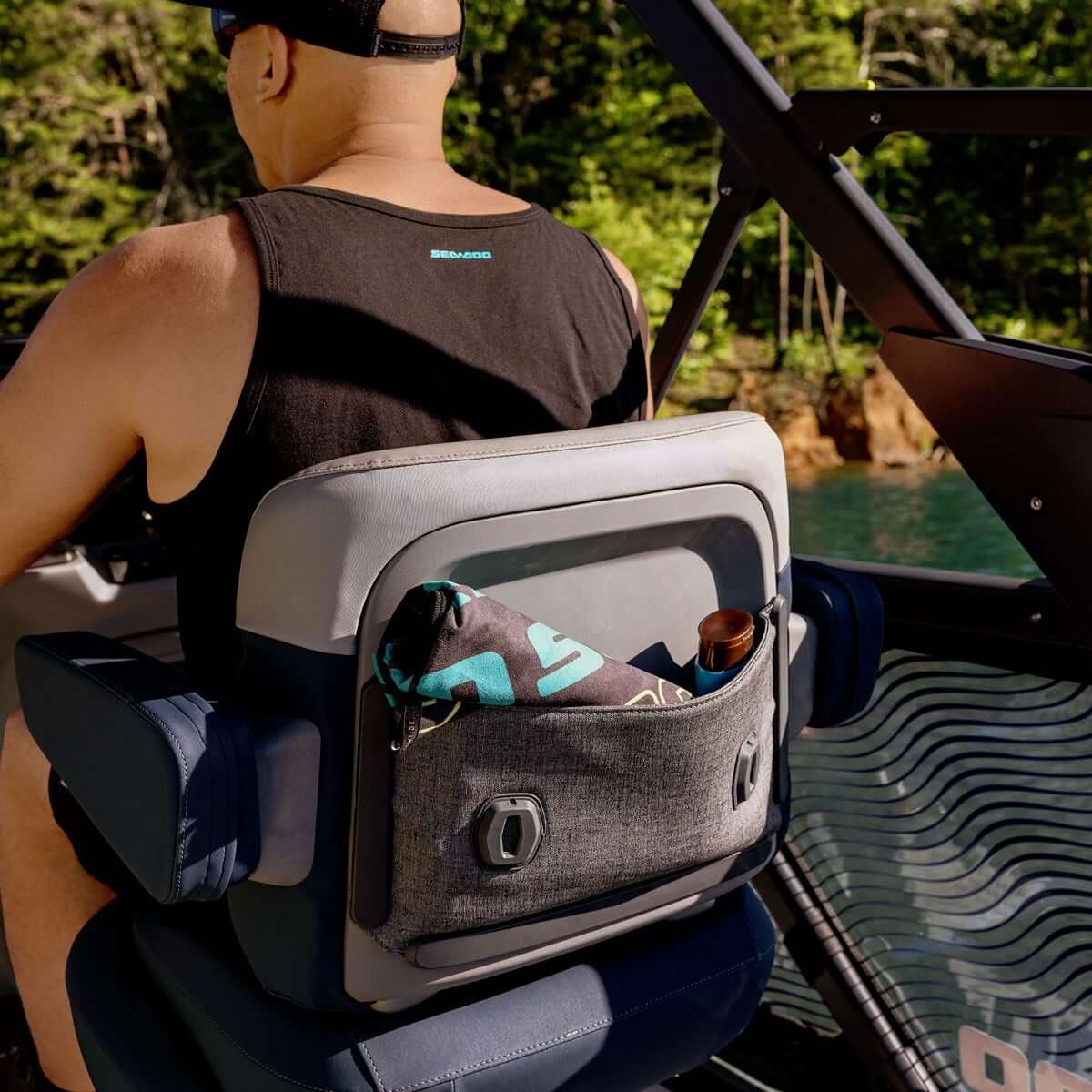 Sea-Doo Driver Seat Storage bag mounted on Switch pontoon seat back with towel and cup inside