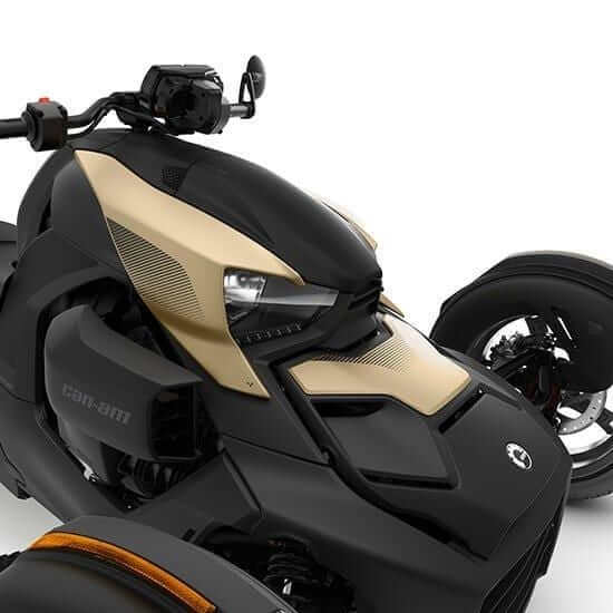 Gold colored panels on Ryker 3 wheel motorcycle on white background