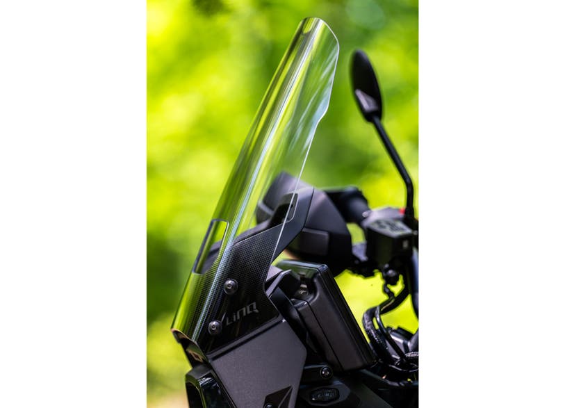 Can-Am Origin LinQ adjustable clear windshield mounted on EV motorcycle cockpit