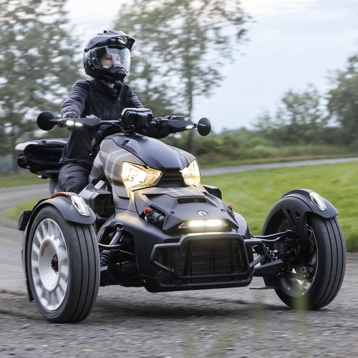 Can-Am Ryker three-wheeler with Moka Plaid exclusive panel kit ridden on road front view