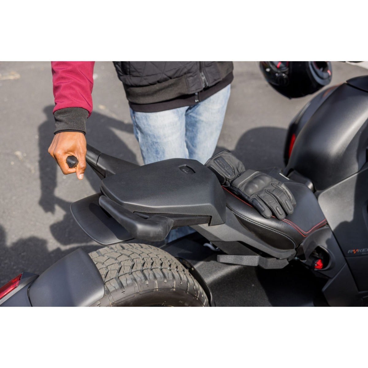 Can-Am Ryker passenger seat installed on three-wheeler rear deck close-up