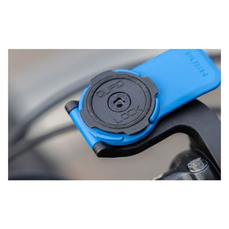 Quad Lock mounting mechanism on bike handlebar.
