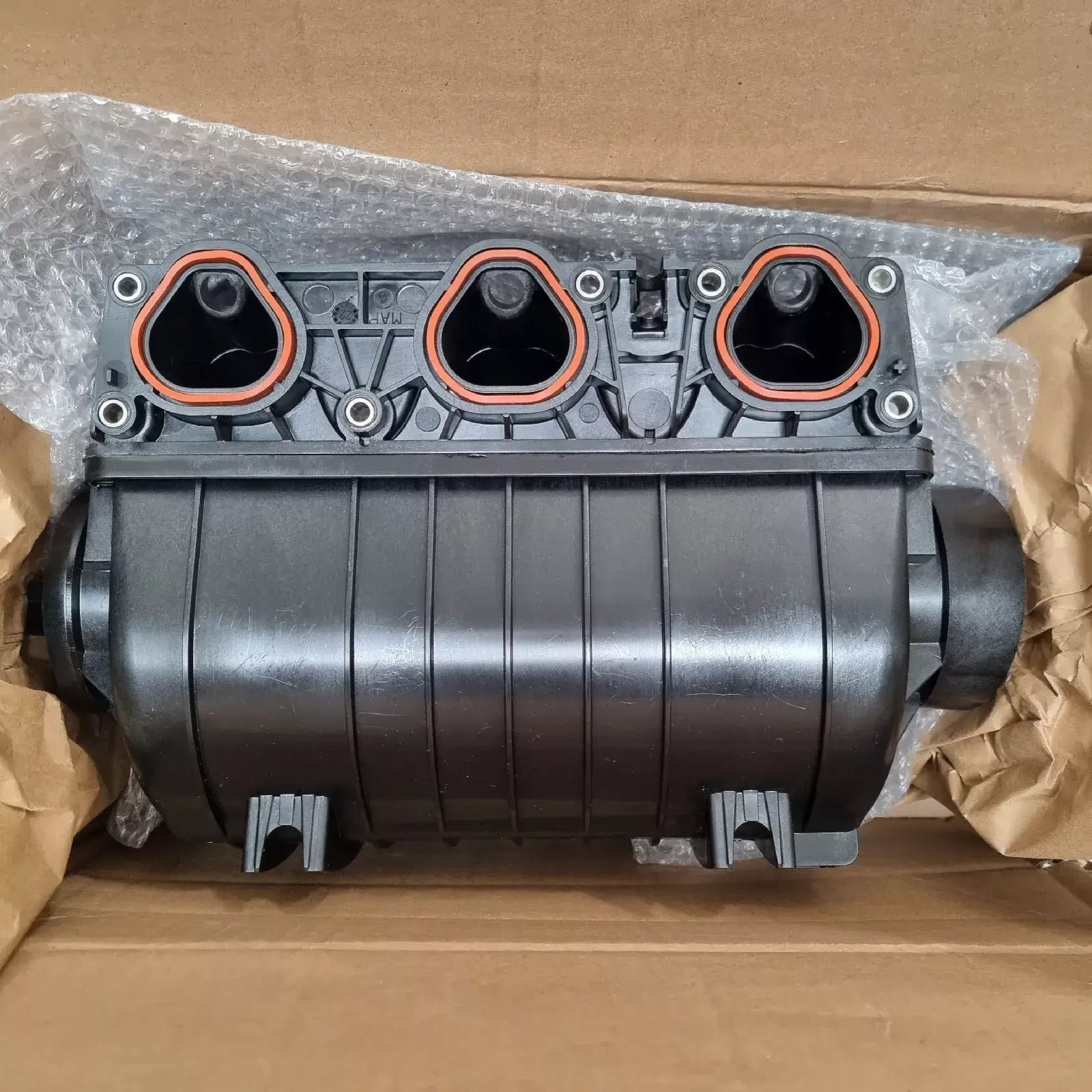 Induction manifold for Sea-Doo RXP/RXT engines, designed for 230/300 HP performance, shown in packaging.