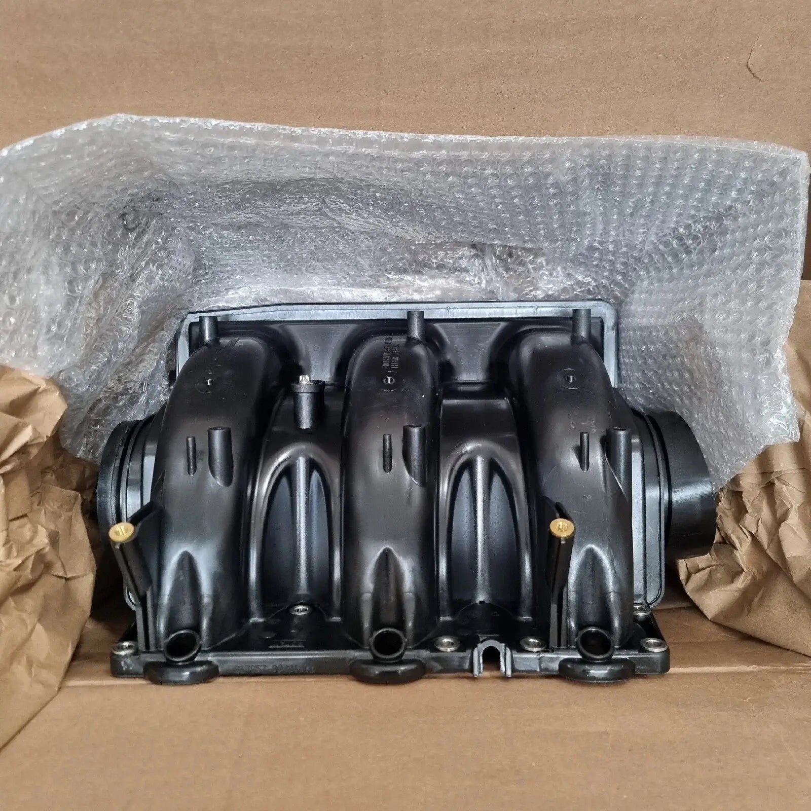 Induction manifold for Sea-Doo RXP RXT 230/300 HP packed in bubble wrap for protection.