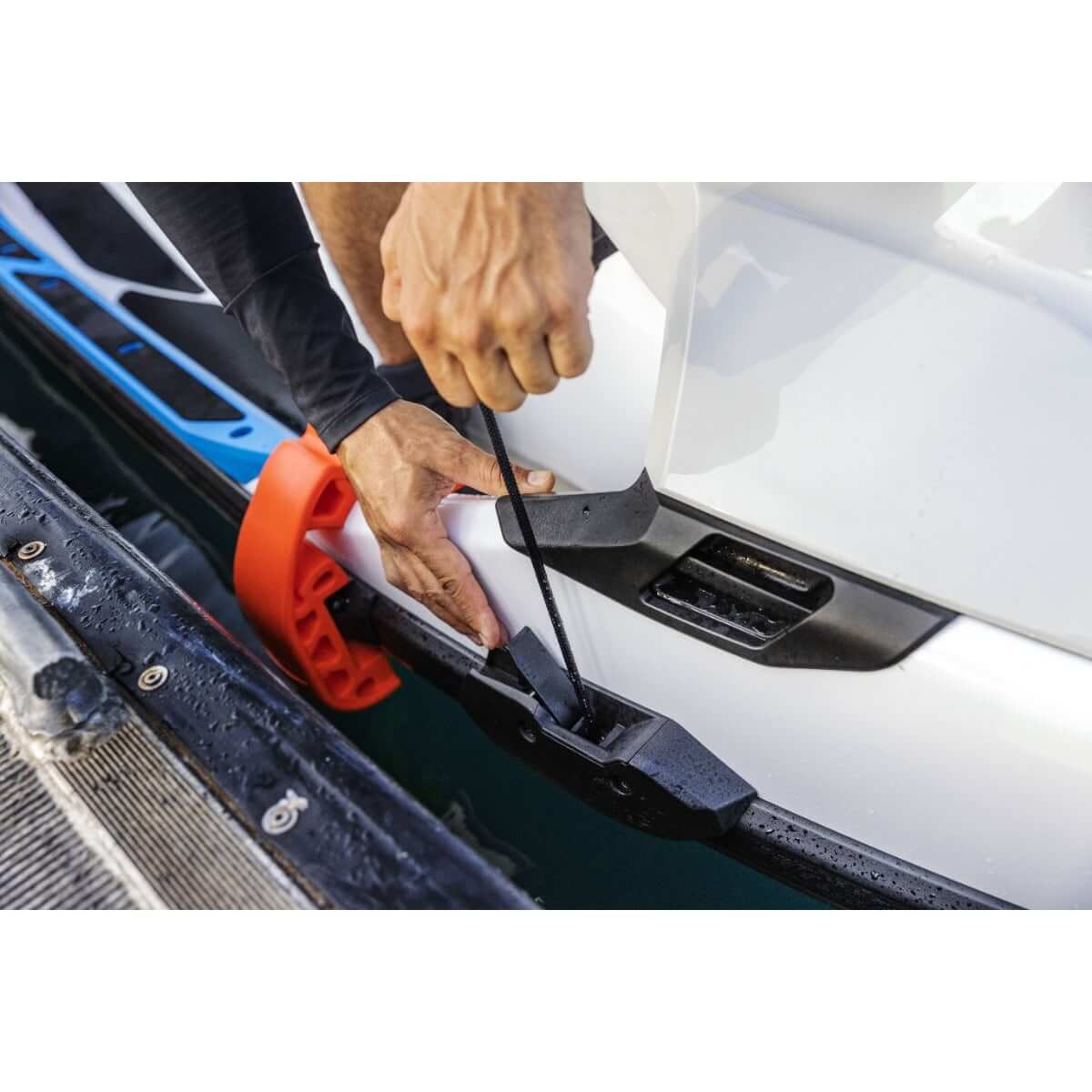 Rider attaching Sea-Doo Speed Tie dock line to Explorer FishPro personal watercraft bow