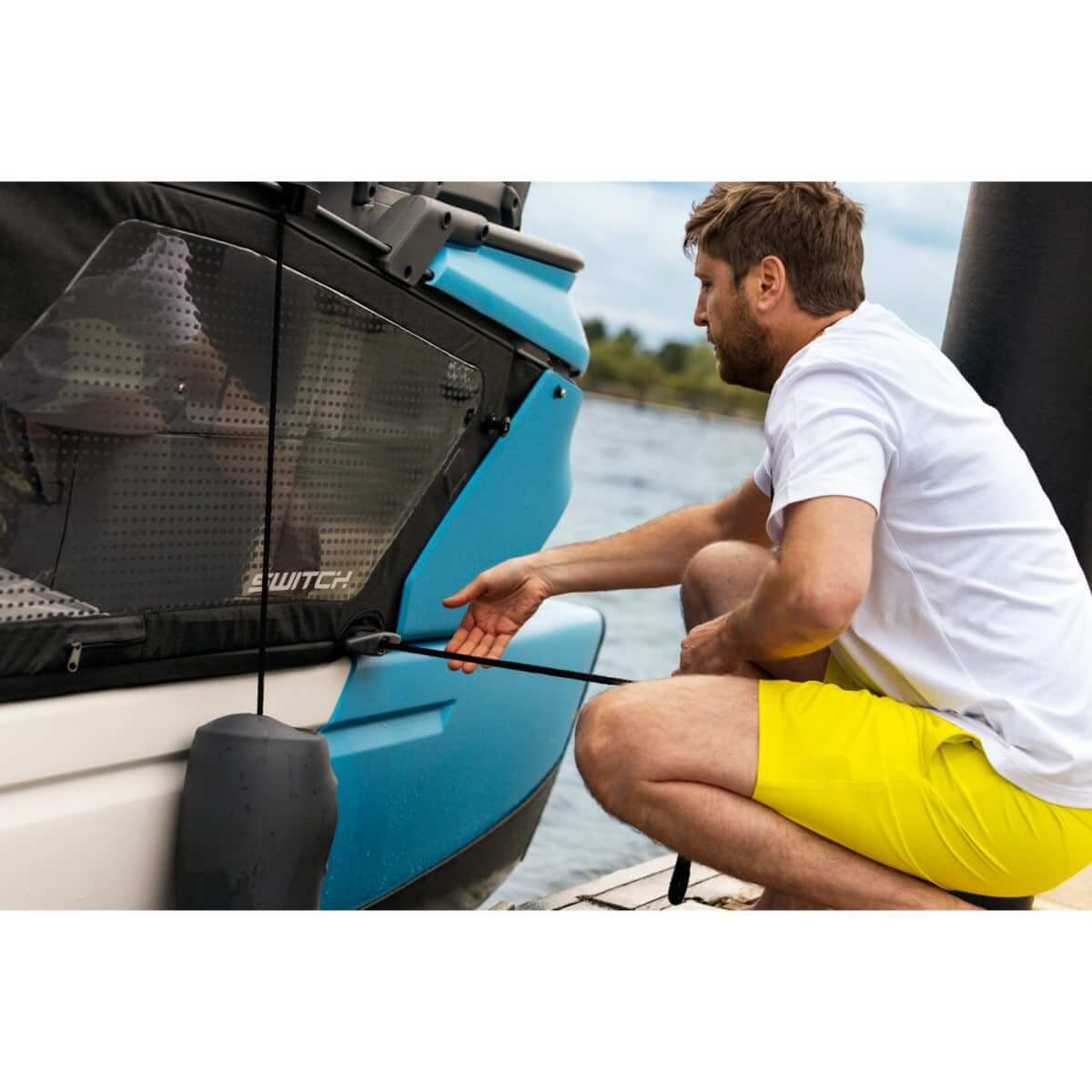 Man attaching Sea-Doo Speed Tie retractable mooring dock line to Switch pontoon boat