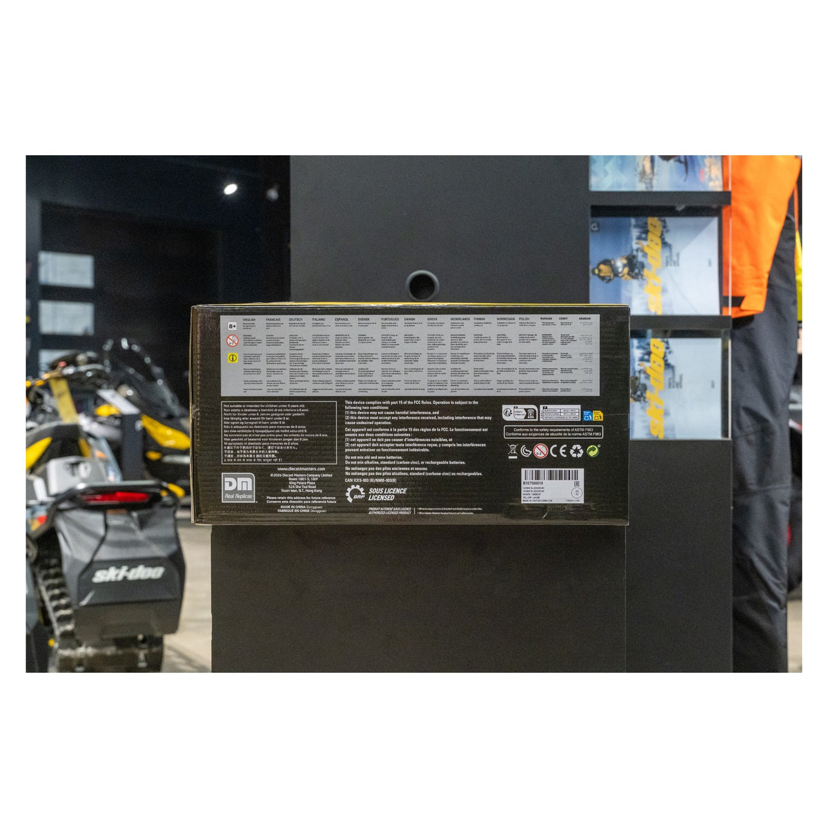 Ski-Doo 1:6 MXZ RC toy snowmobile box back label displayed in showroom, B107590010