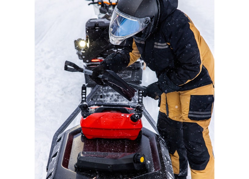 Ski-Doo LinQ tool holder mounted on REV Gen5 snowmobile tunnel with red fuel caddy, 860201846