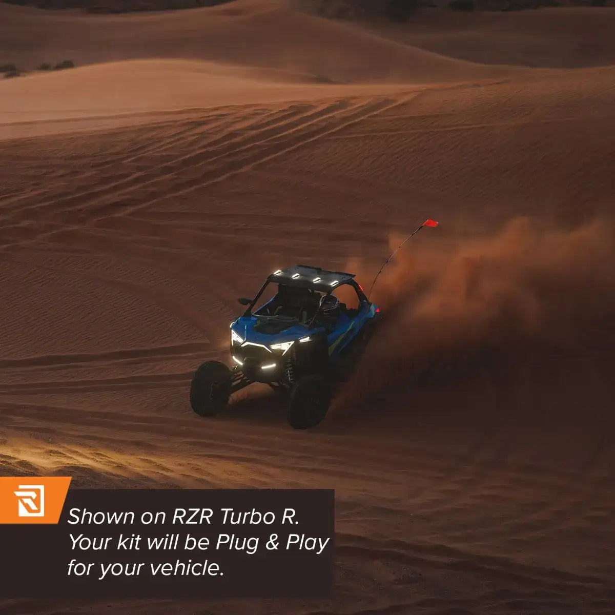 Off-road vehicle driving through sand dunes with promotional text overlay.