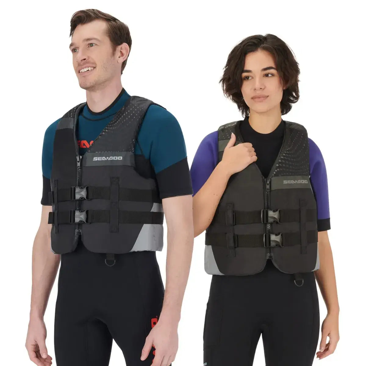 Sea-Doo unisex Motion PFD life jacket worn by two individuals, showcasing a sleek design and adjustable straps for safety.