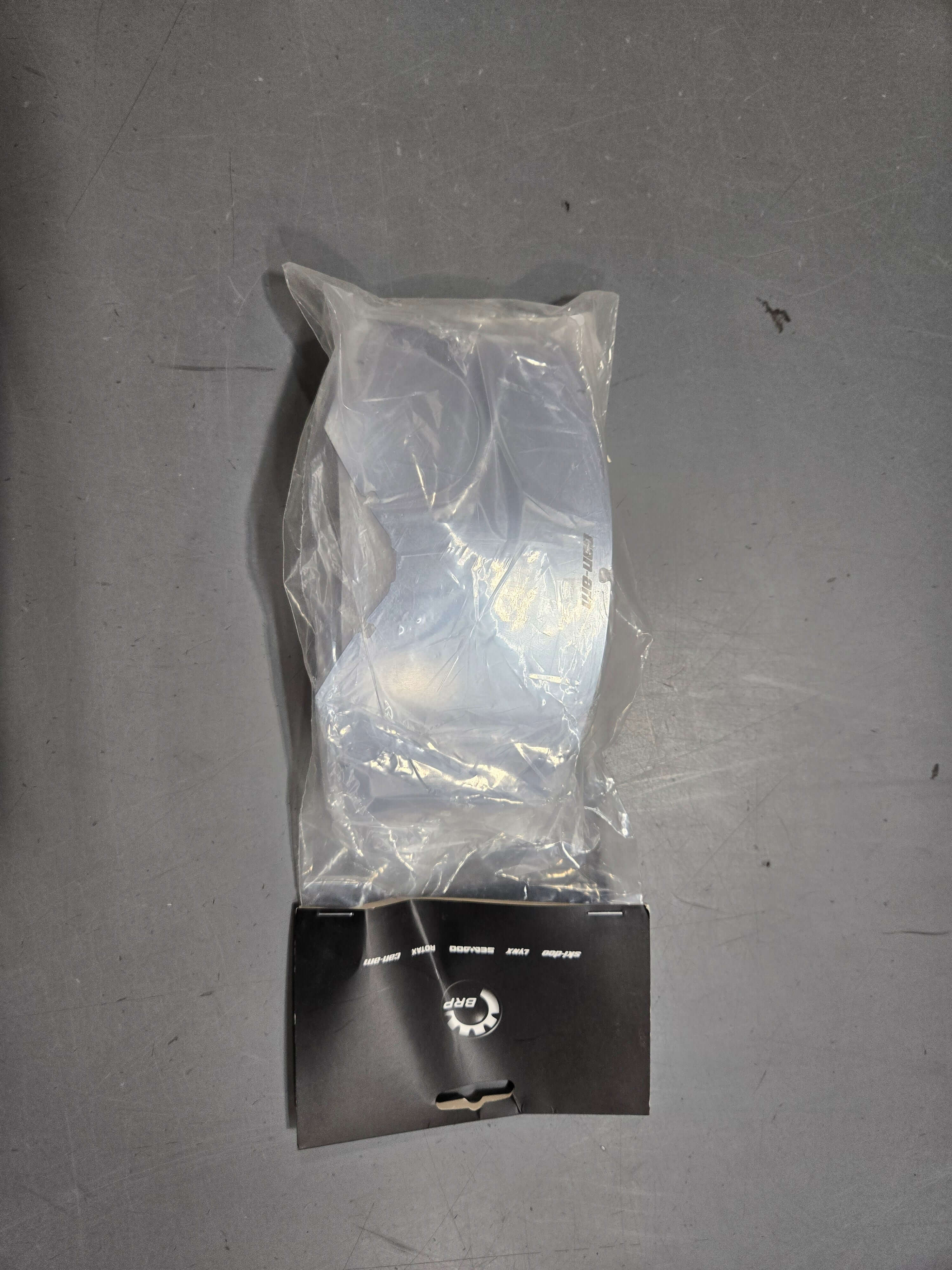 Can-Am Trench OTG Goggles Single UV Lens, 4487930021 | CLEARANCE package on a gray surface