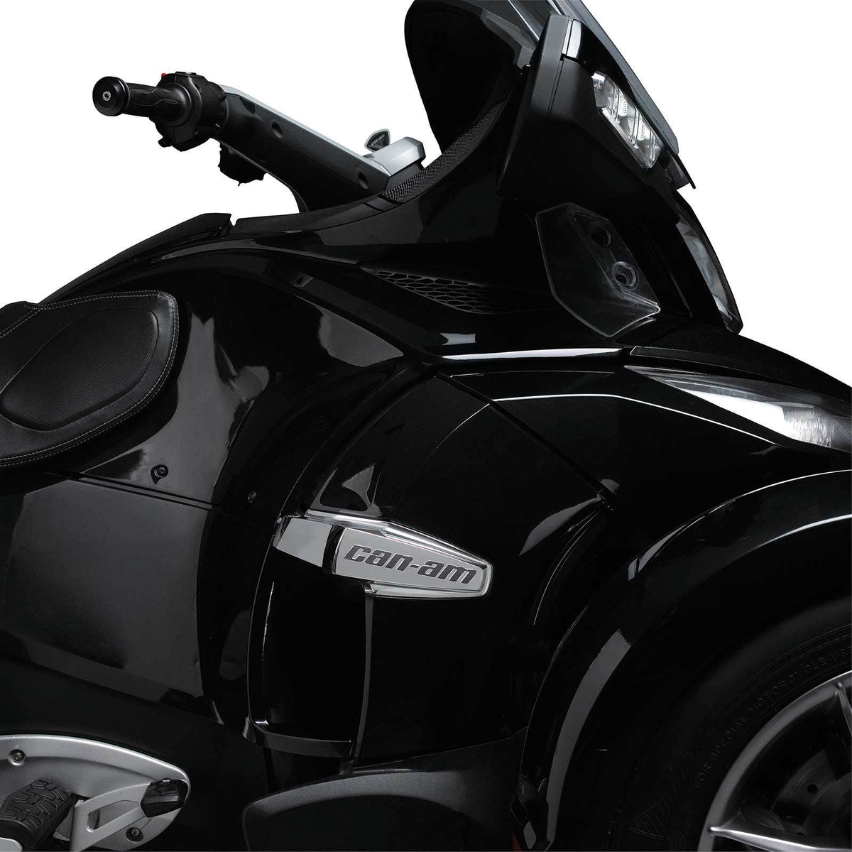 Black Can-Am Spyder RT front fairing with chrome side trim badge close-up