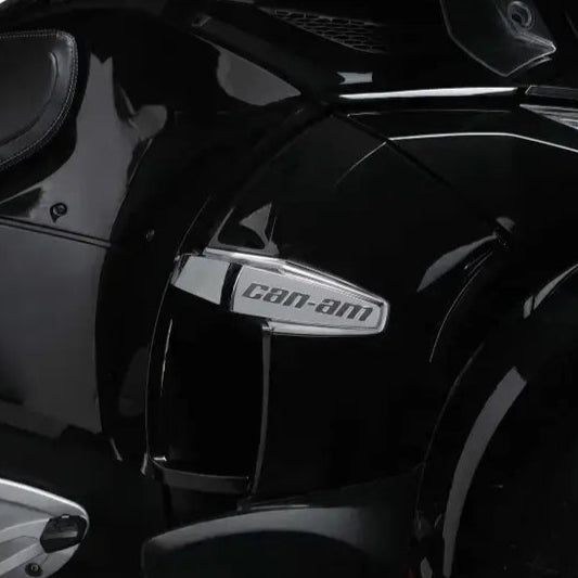 Black motorcycle with 'Can-Am' branding on a white background