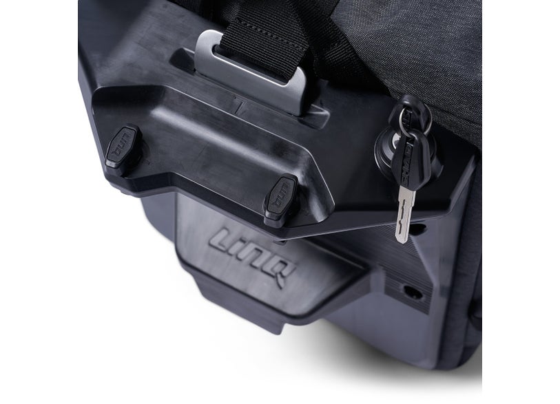 Can-Am LinQ saddlebag mounting bracket and lock key detail on Origin EV motorcycle bag