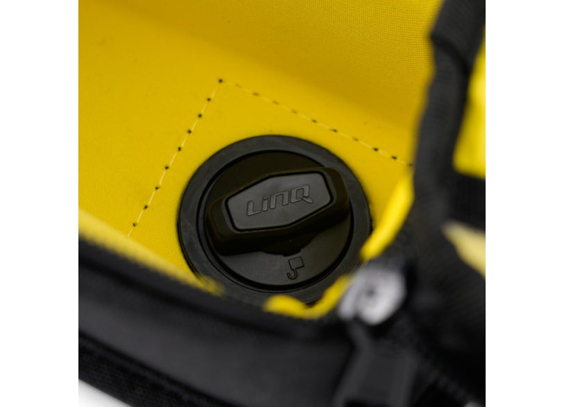 Close-up LinQ quick-attach mount on Can-Am Pulse tank bag yellow black EV motorcycle luggage
