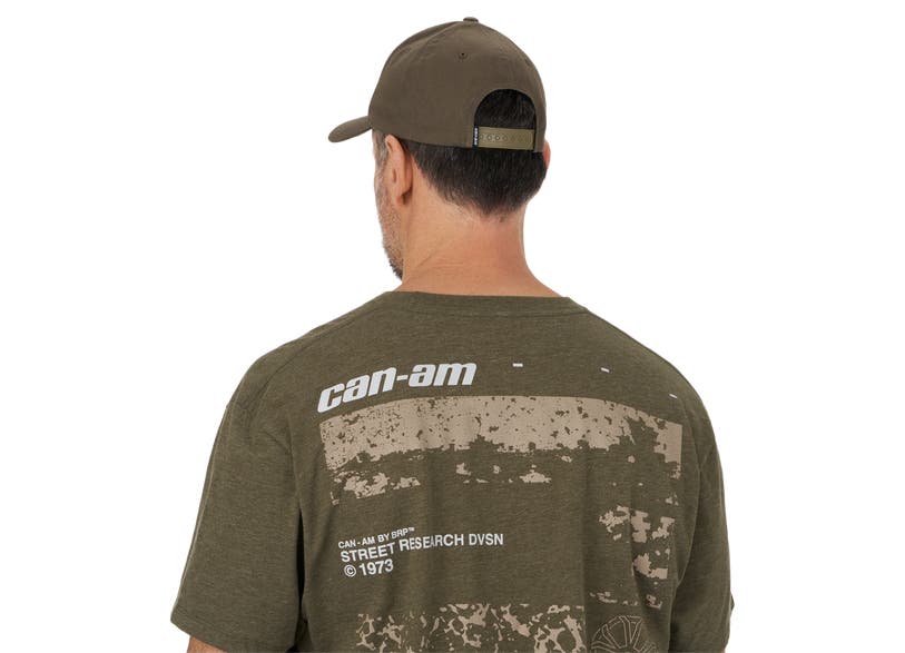 Can-Am Signature Flex Fit cap olive green worn back view with matching graphic t-shirt