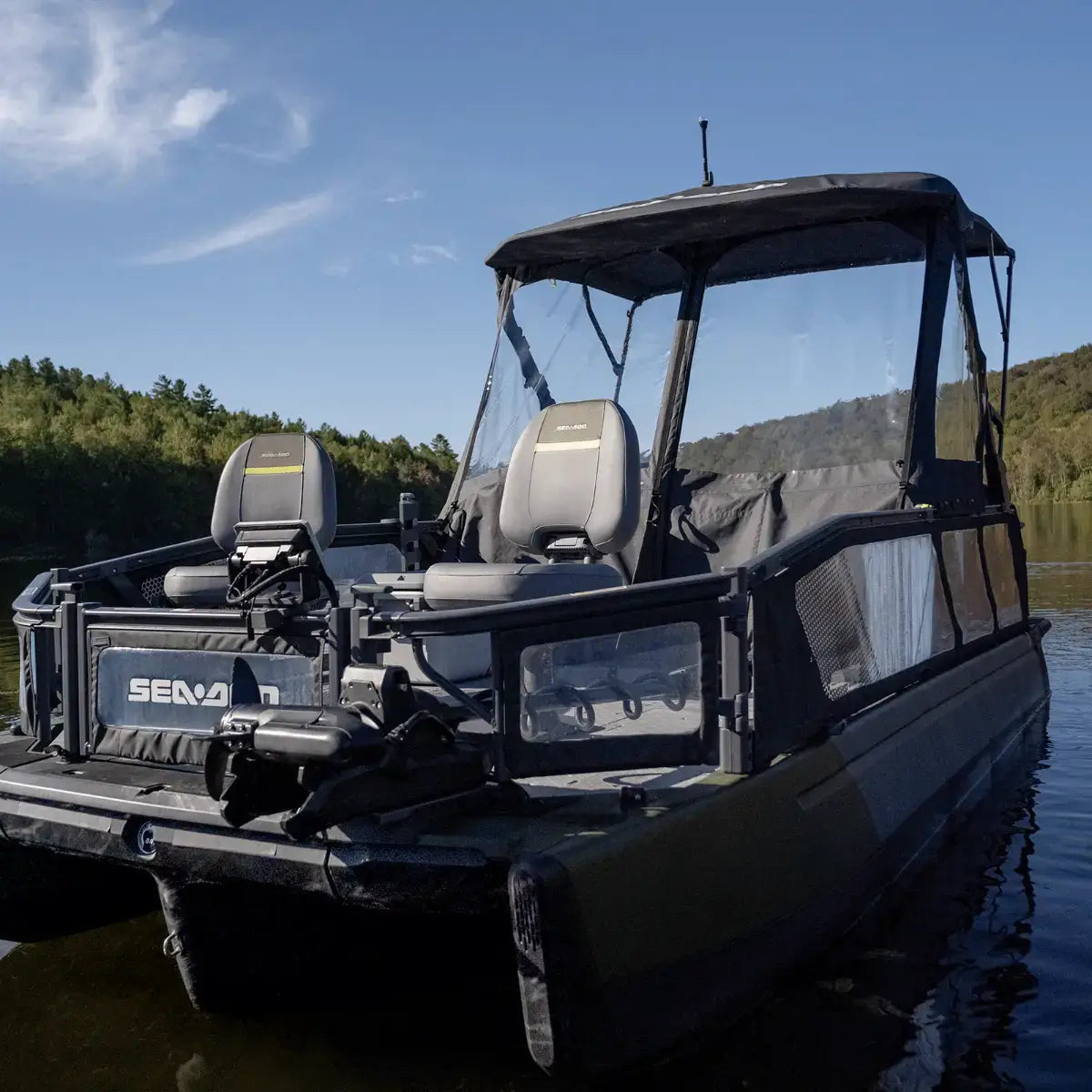 Sea-Doo Switch pontoon boat with black front dodger canvas shield installed on lake