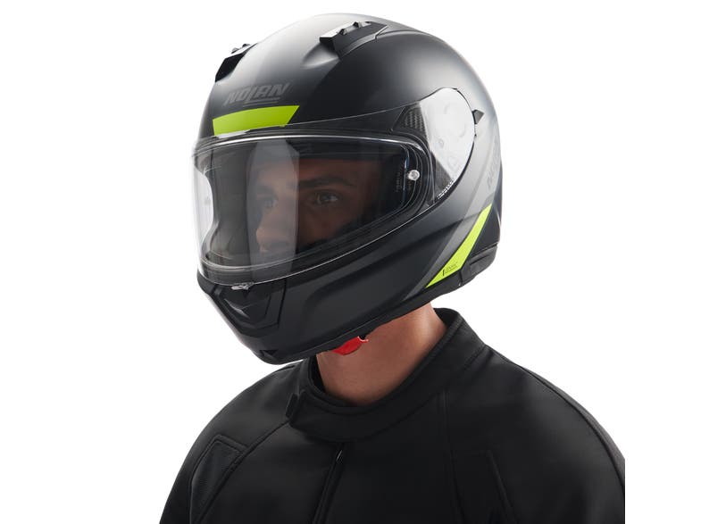 Rider wearing Can-Am N60-6 Staple full face helmet black with hi-vis yellow accents DOT certified