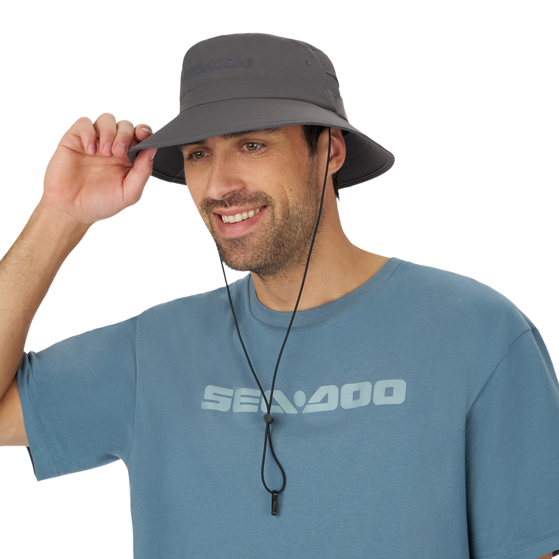 Man adjusting the chin cord on the Sea-Doo Fishing Hat, front view