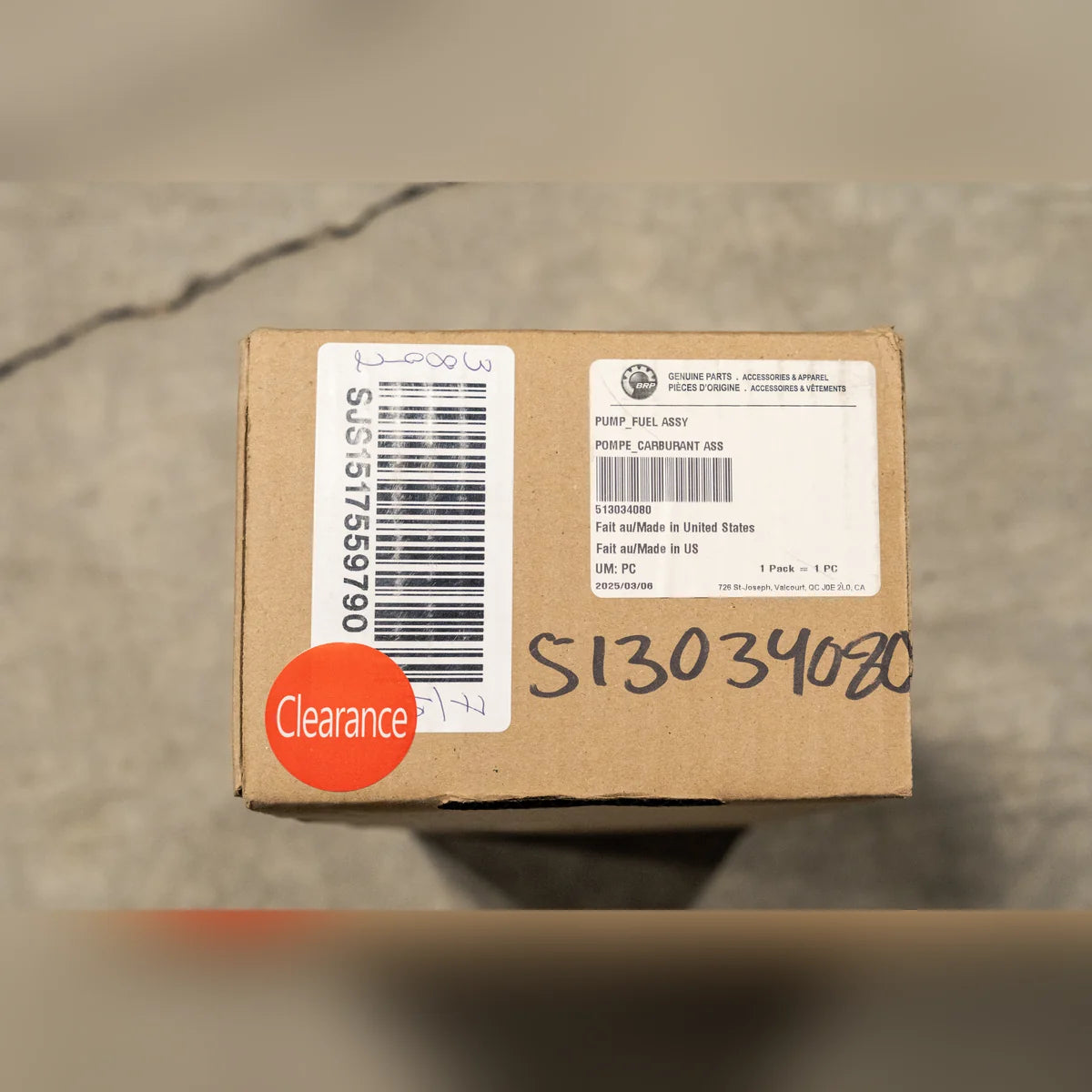 Ski-Doo fuel pump assembly 513034080 clearance unit, genuine BRP parts label with part number and clearance sticker