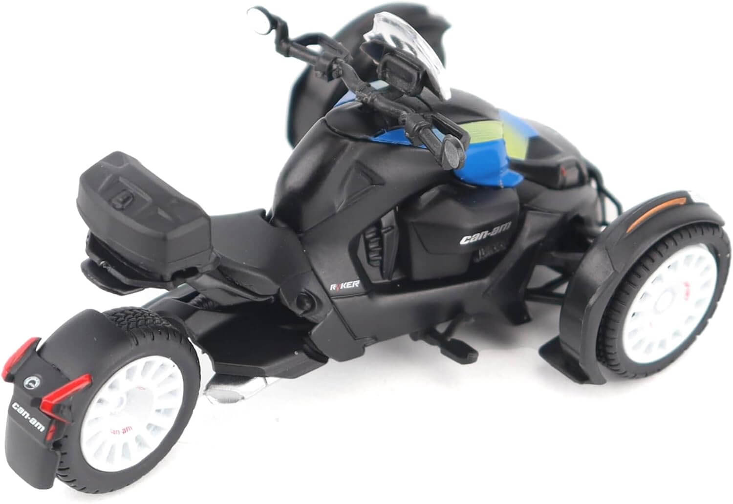 Black model vehicle with three wheels on a white background