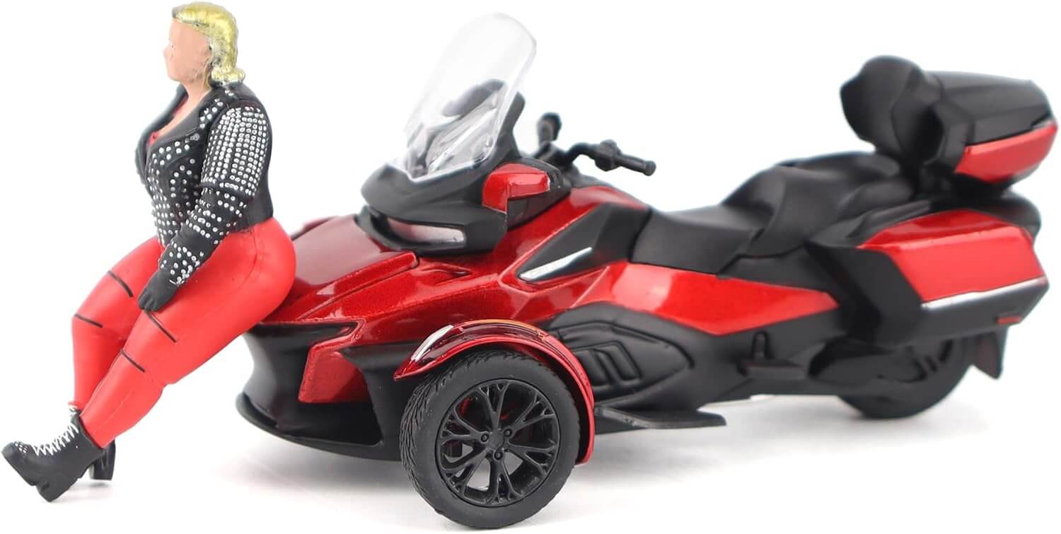 Model of a red and black three-wheeled toy vehicle with a person sitting on it, on a white background