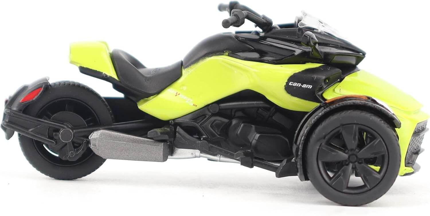 Model of a three-wheeled vehicle with a bright yellow and black design on a white background