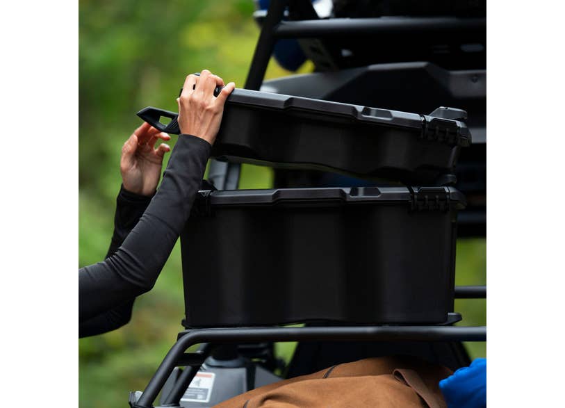 Rider mounting Can-Am LinQ 7.8 US Gal modular cargo box on off-road vehicle rack
