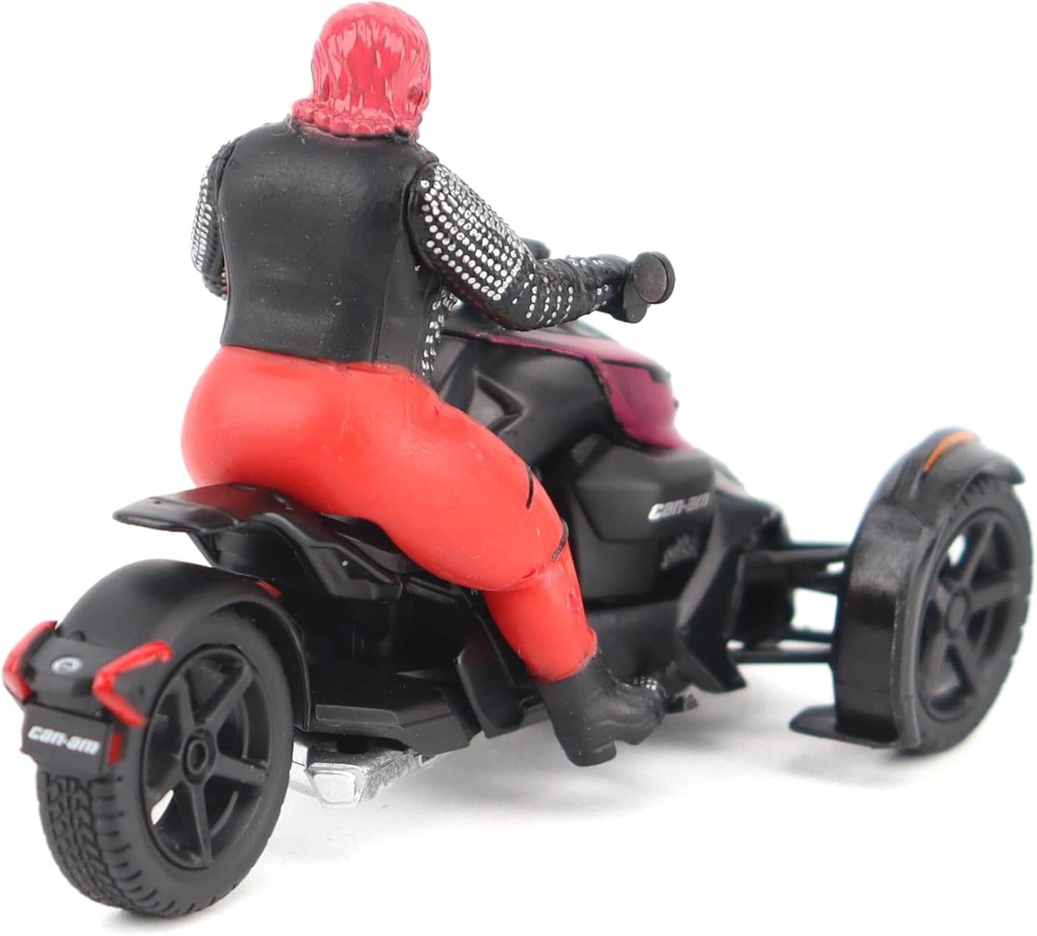 Model of a person riding a black and red three-wheeled vehicle on a white background
