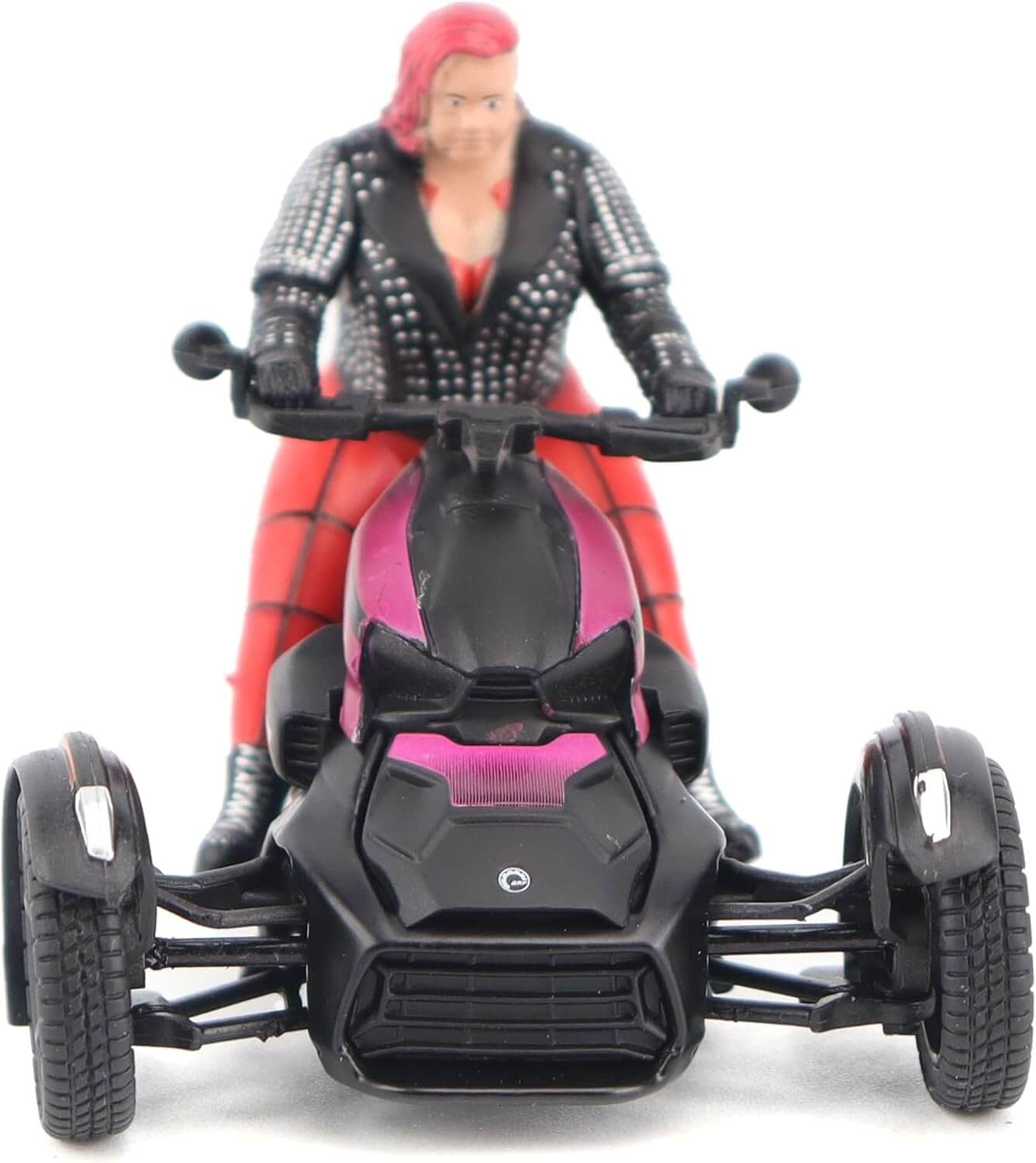 Toy figure of a person with red hair riding a toy three wheeled vehicle on a white background