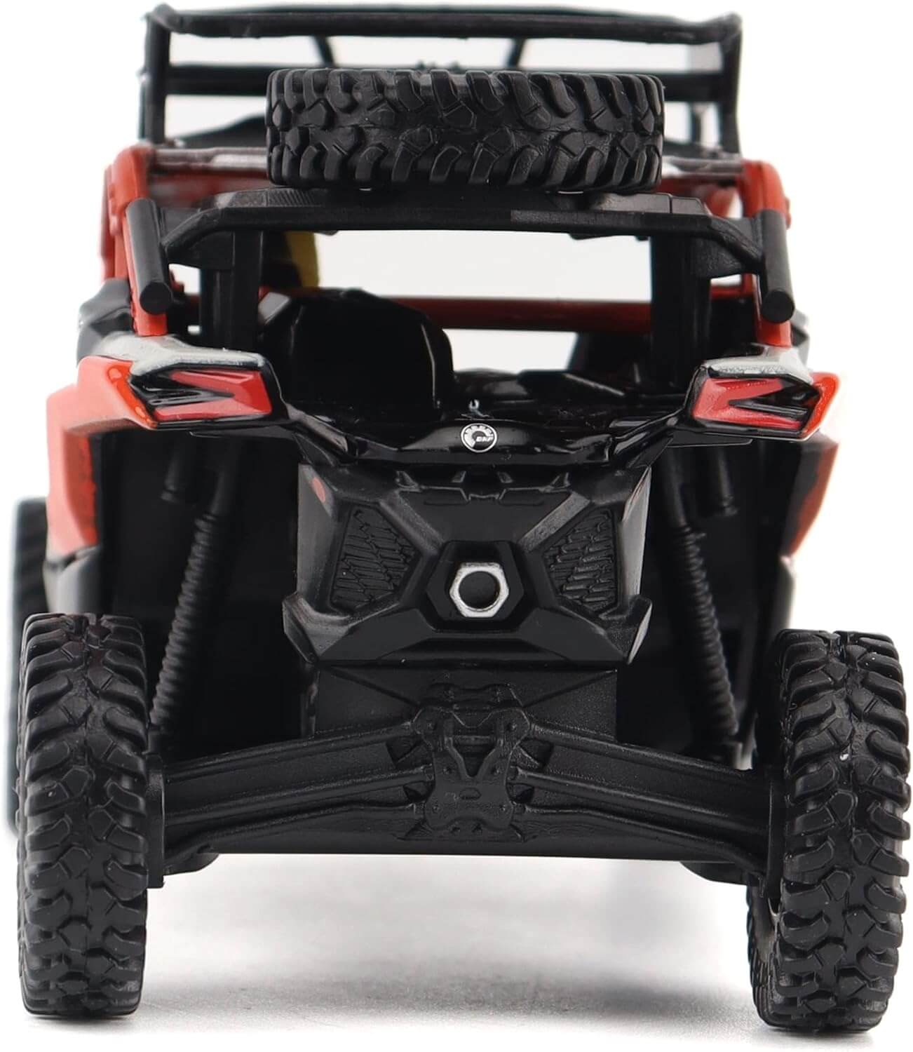 Close-up of a toy off-road vehicle with black tires and red body on a white background