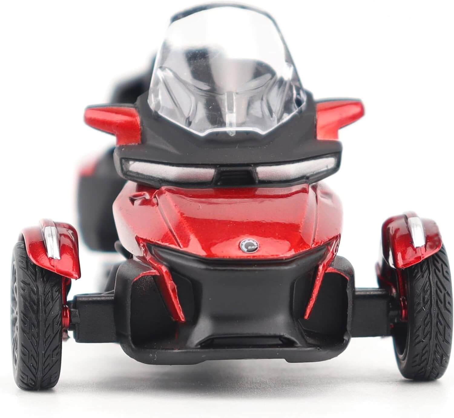 Red and black three-wheeled toy vehicle on a white background