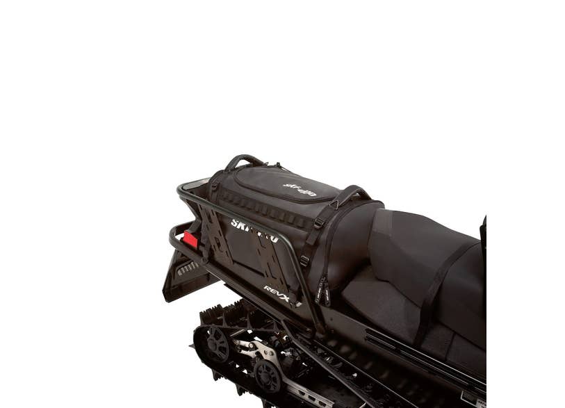 Ski-Doo black 80L cargo bag mounted on REV-XP rear rack behind seat