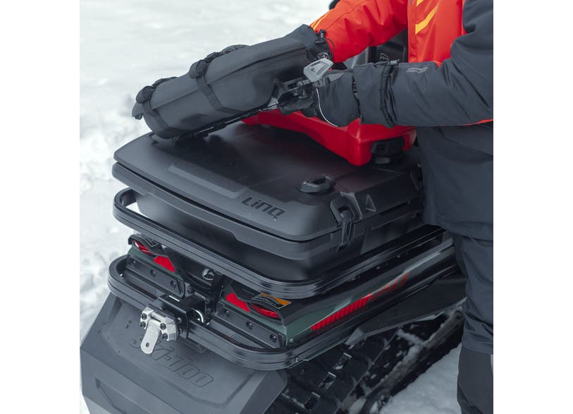 Rider installing a Ski-Doo LinQ cargo box on the Heavy-Duty Hitch Rear Bumper 860201795