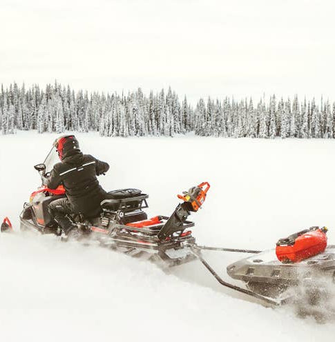 Ski-Doo Chain Saw Holder 860202979 on a snowmobile on the trail