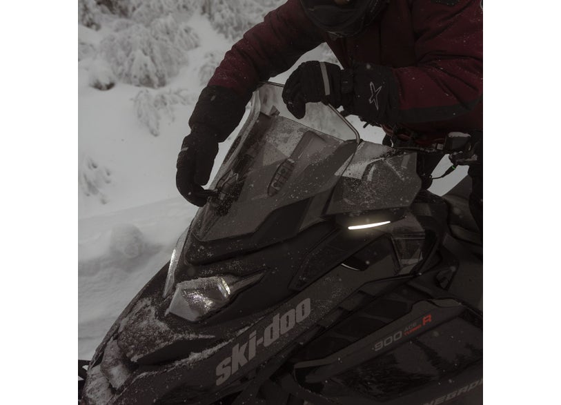 Rider adjusting the Ski-Doo Adjustable Windshield Medium to High 860202615