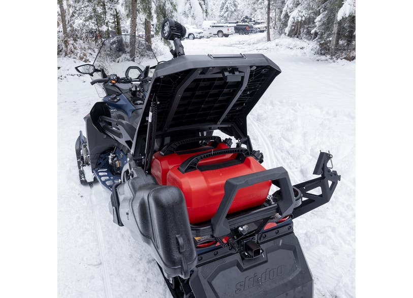 Ski-Doo Stackable LinQ Deck rear cargo rack with open lid storing red fuel canister on snowmobile, 860202746