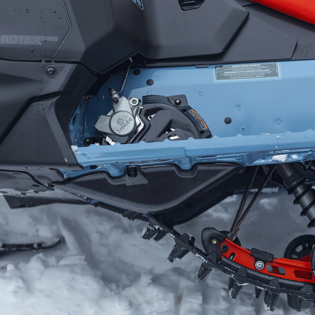 Ski-Doo Brake and Chaincase Protectors, brake area on a sled in the snow, 860202943