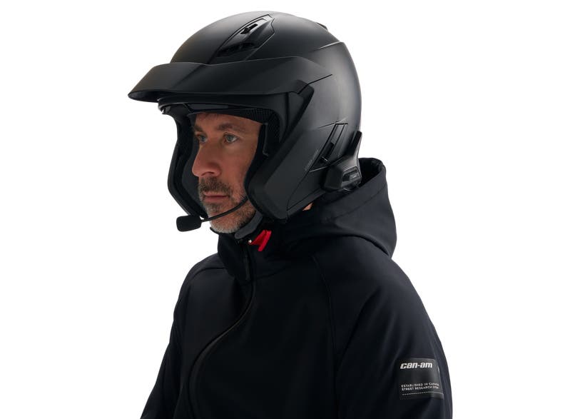 Rider wearing Can-Am open-face helmet with BRP Vibe Universal Comm System microphone and speaker unit