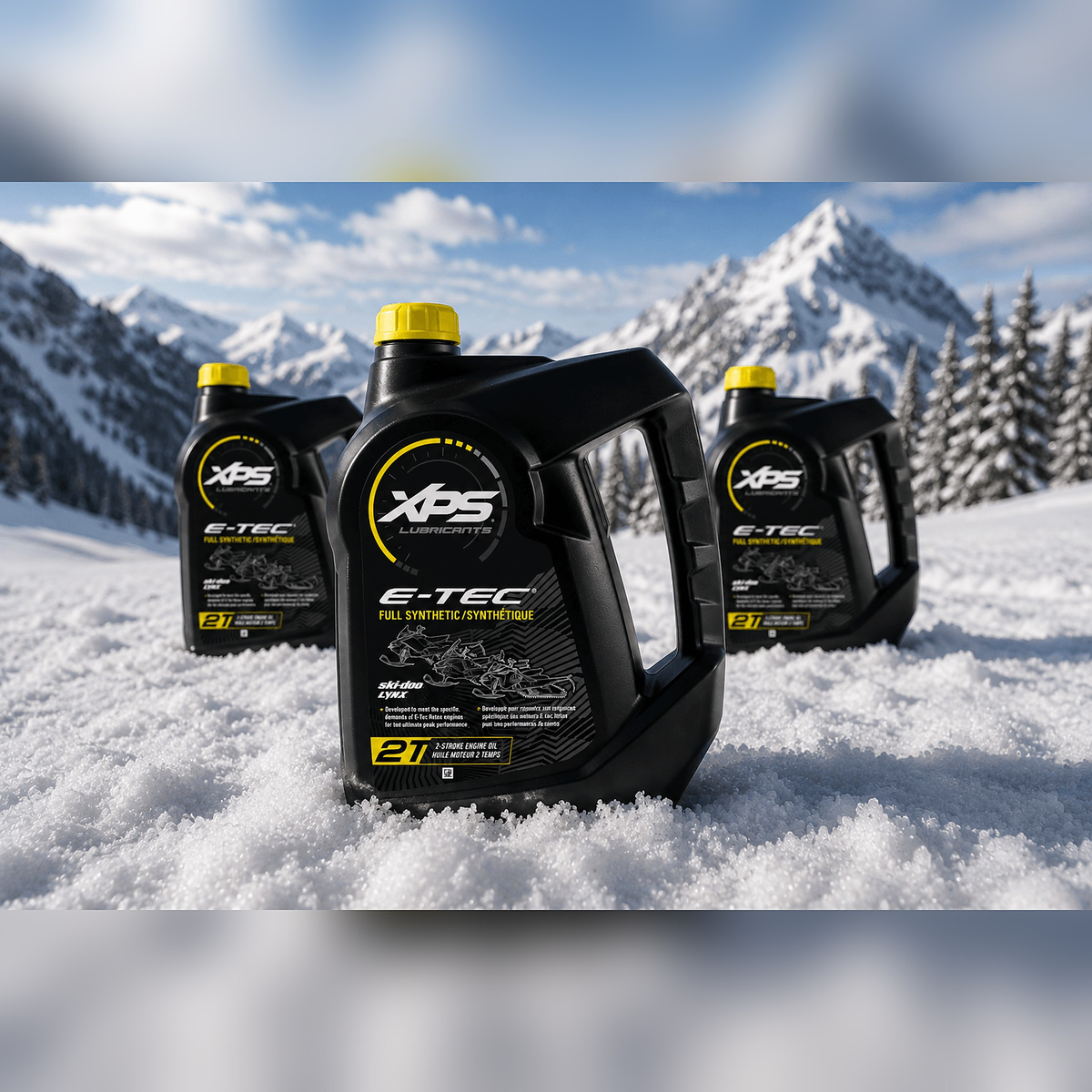 XPS E-TEC full synthetic 2T oil jugs for Ski-Doo Lynx snowmobiles standing in snow with mountain backdrop
