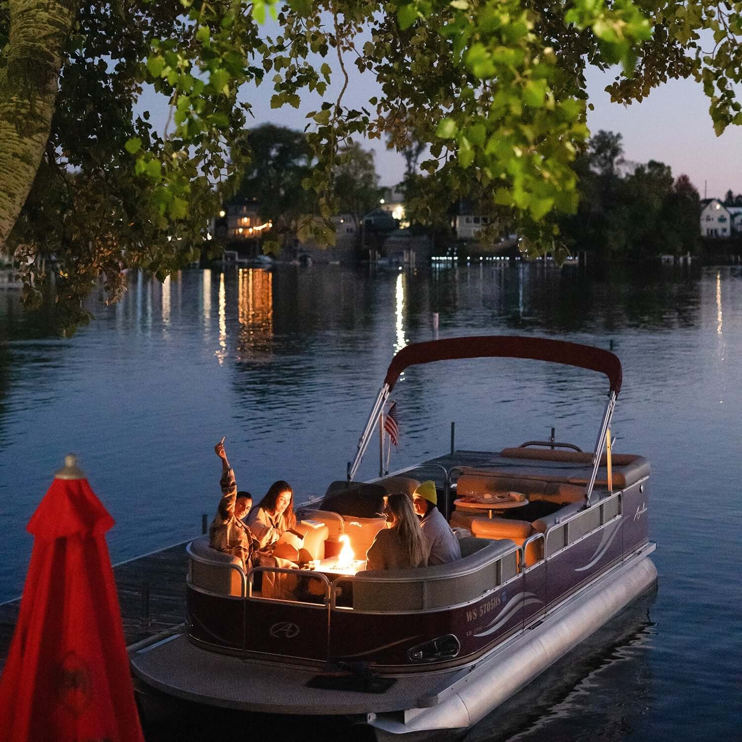 Floating Flame Portable Fire Pit on a boat with flame active
