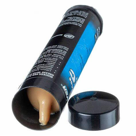 tube with a beige cream inside on a white background