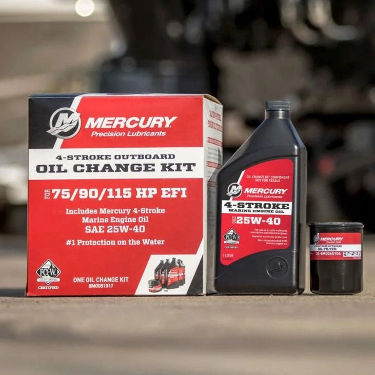 Mercury outboard motor oil containers with a blurred boat and trailer in the background