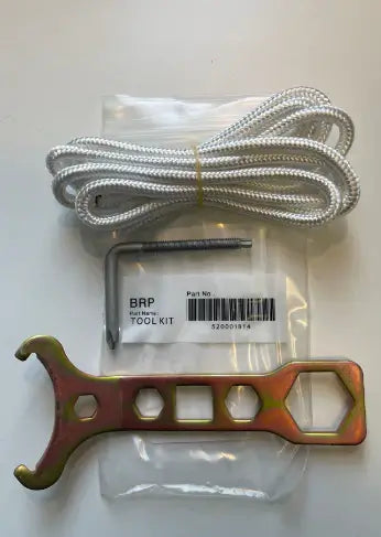 Metal tool, rope, and BRP part on a white background