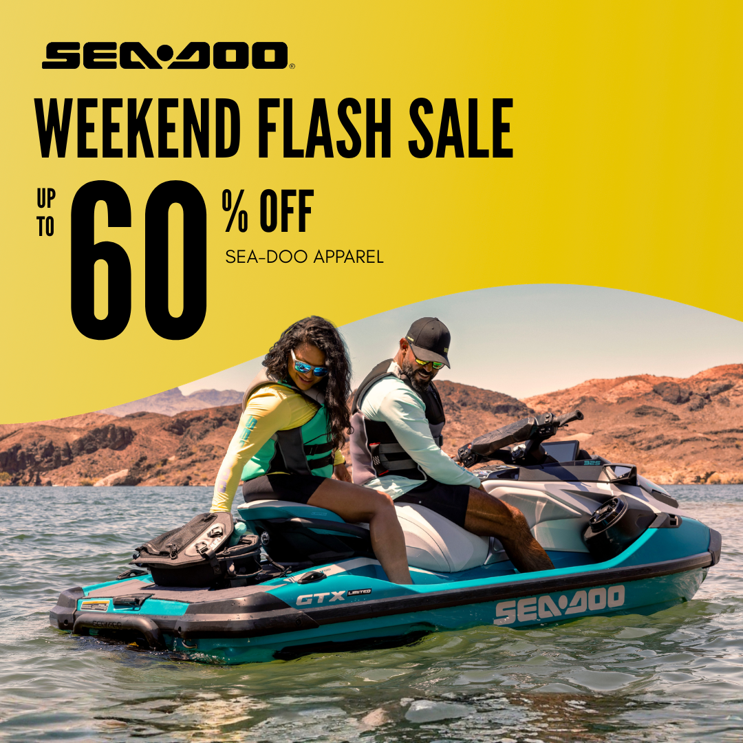 A promotional advertisement for Sea-Doo featuring two people riding a teal and black Sea-Doo GTX-X jet ski on water with mountains in the background. The left side has a bright yellow graphic with text reading 'SEA-DOO WEEKEND FLASH SALE UP TO 60% OFF SEA-DOO APPAREL'.