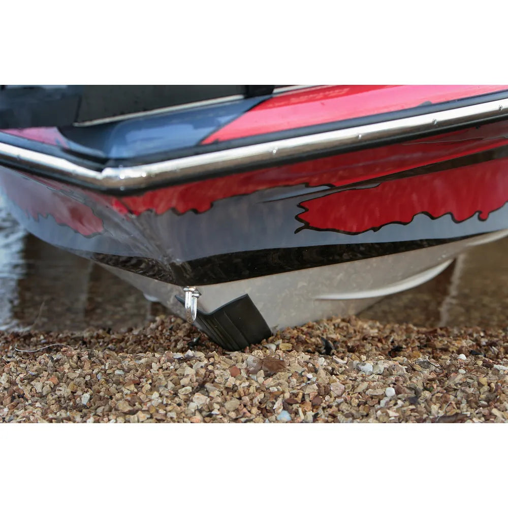 Megaware KeelGuard black keel protector installed on red bass boat bow beached on gravel