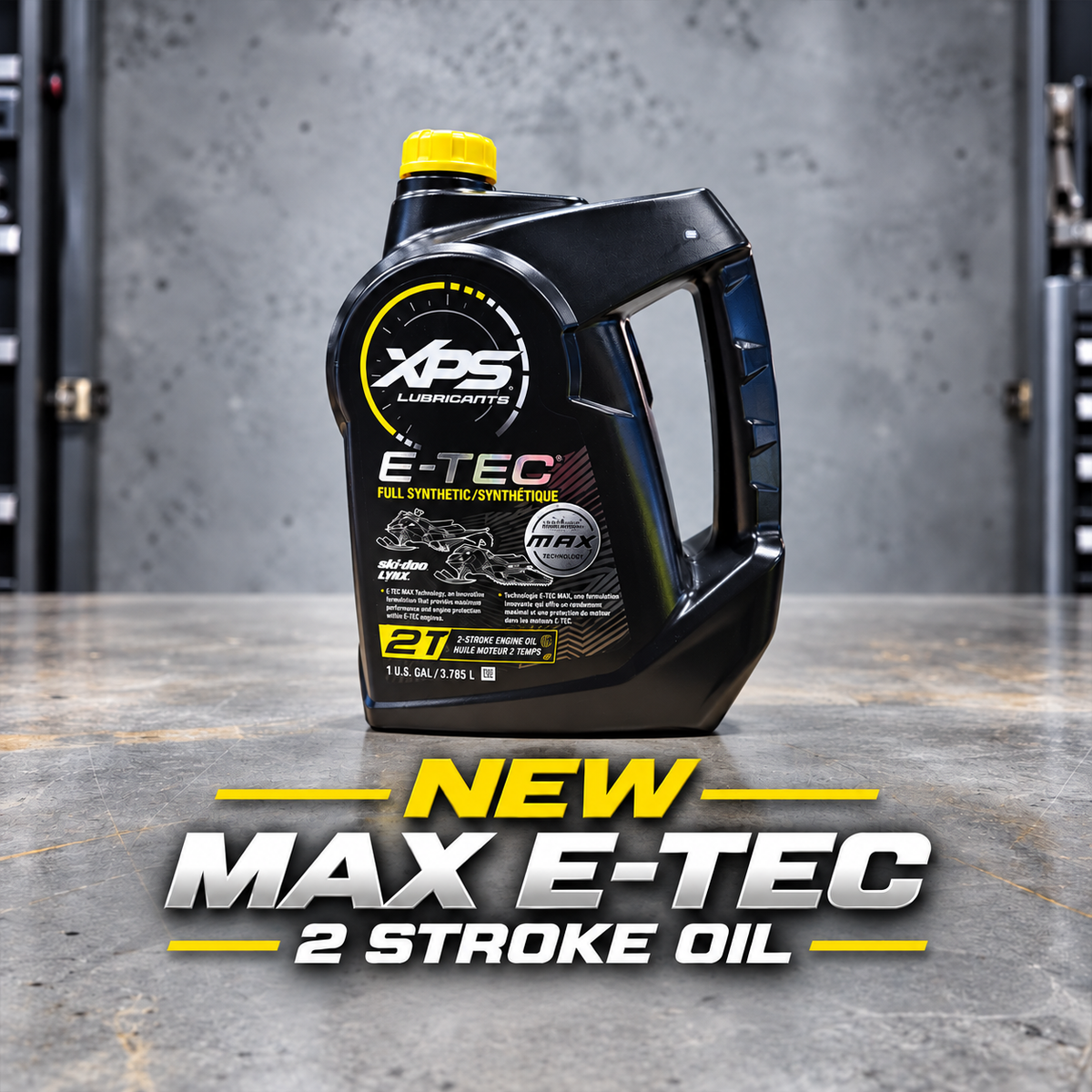 A black XPS Lubrication E-TEC 2-stroke oil container with a yellow cap, standing on a concrete floor against a gray workshop wall. Large promotional text at the bottom reads 'NEW MAX E-TEC 2 STROKE OIL'.